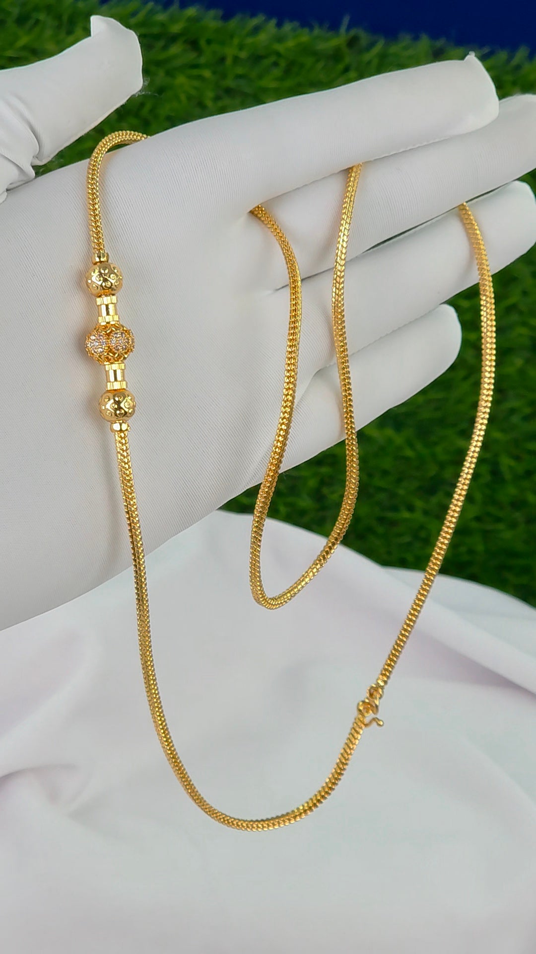 26 in gold finish Thalli chains